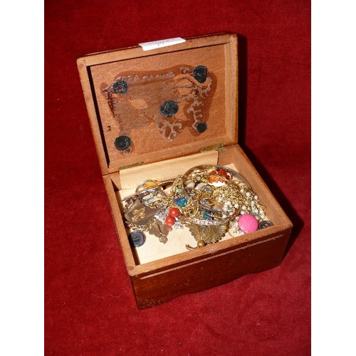 57 - SMALL WOODEN MUSICAL JEWELLERY BOX (NEEDS REPAIR) CONTAINING COSTUME JEWELLERY.