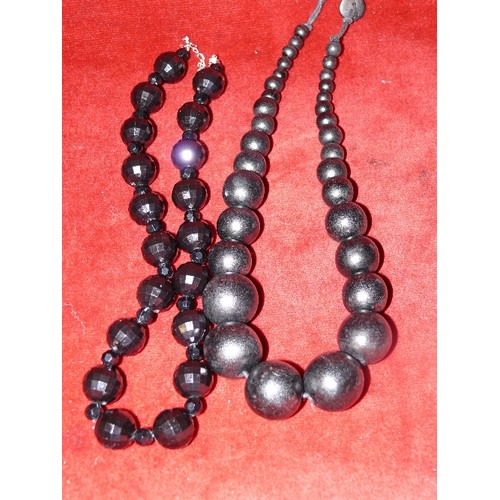 43 - TWO BLACK LARGE BEADED NECKLACES - VERY 60s, WITH SAME ERA PLASTIC CHAIN NECKLACE.