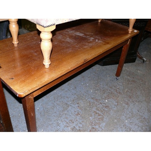 443 - MID-CENTURY TABLE ON CASTERS.