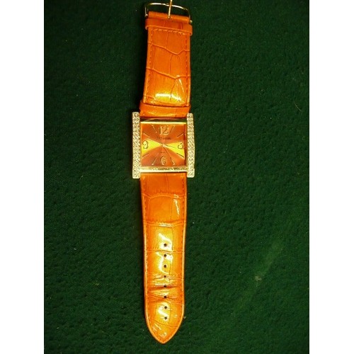 11B - ORANGE AND DIAMANTE FACED LADIES WATCH FROM THE JOAN RIVERS COLLECTION.