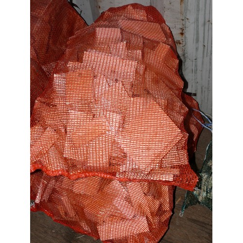 401B - TWO ORANGE NETS FIREWOOD OFFCUTS