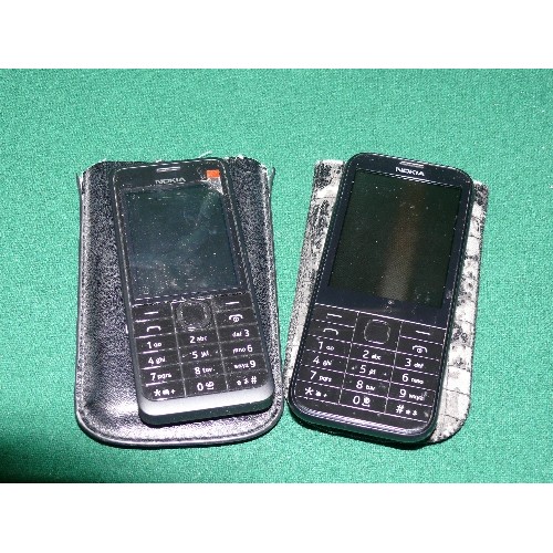 111 - TWO NOKIA MOBILE PHONES BOTH WITH CASES