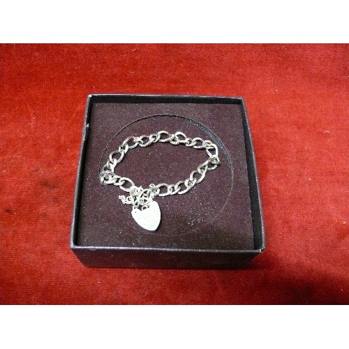 17 - A STERLING SILVER BRACELET WITH HEART SHAPED CLASP - LONDON HALLMARK