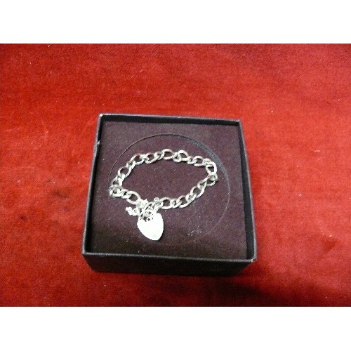 17 - A STERLING SILVER BRACELET WITH HEART SHAPED CLASP - LONDON HALLMARK