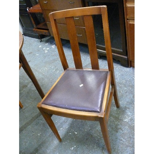 393 - TEAK MACKINTOSH OF KIRKCALDY EXTENDING TABLE AND FOUR CHAIRS.