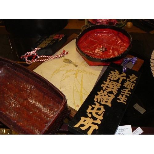 256 - A GROUP OF ORIENTAL ITEMS, PICTURE OF BIRDS ON SILK, WOODEN PLAQUES, WOVEN SHALLOW DISH IN RED LACQU... 