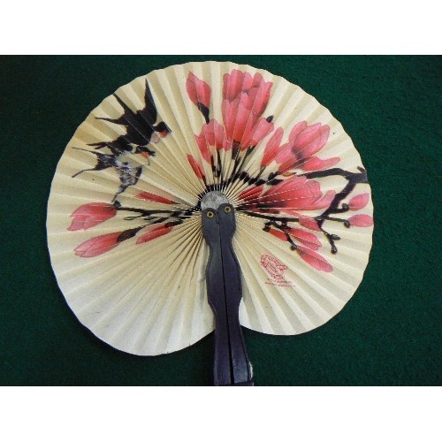 257 - TWO ORIENTAL HAND FANS AND BAODING BALLS IN A FABRIC COVERED BOX.