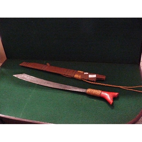 38 - VINTAGE MID 20TH AFRICAN MACHETE WITH WOODEN SHEATH, RED PAINTED GRIP.