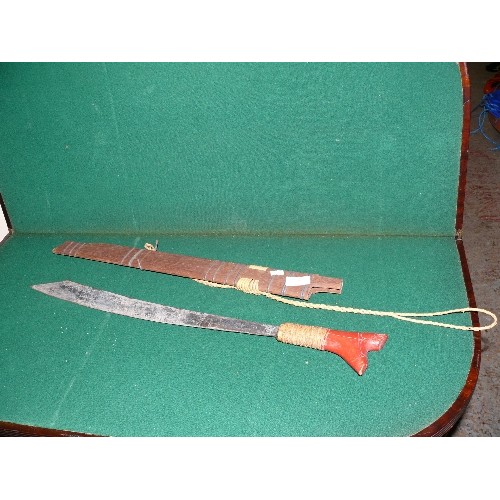 38 - VINTAGE MID 20TH AFRICAN MACHETE WITH WOODEN SHEATH, RED PAINTED GRIP.