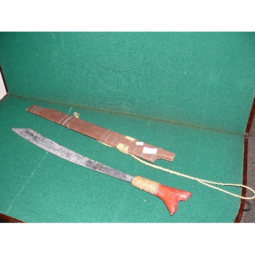 38 - VINTAGE MID 20TH AFRICAN MACHETE WITH WOODEN SHEATH, RED PAINTED GRIP.