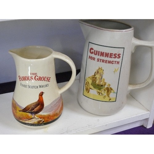 90F - A FAMOUS GROUSE WHISKY WATER JUG BY CASTLE CERAMICS AND A GUINNESS WATER JUG.