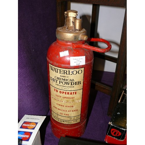 105 - A VINTAGE DECORATIVE FIRE EXTINGUISHER WITH WATERLOO LABEL.