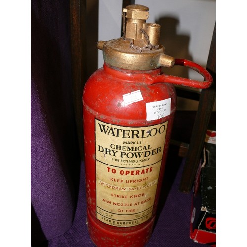 105 - A VINTAGE DECORATIVE FIRE EXTINGUISHER WITH WATERLOO LABEL.