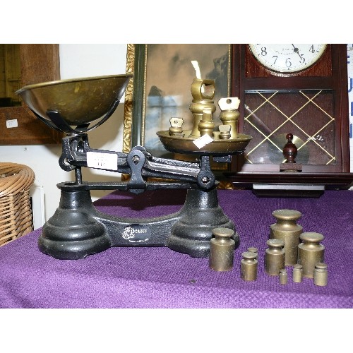 114 - CAST IRON AND BRASS SET OF SCALES BY LIBRASCO WITH TWO SETS OF BRASS WEIGHTS.