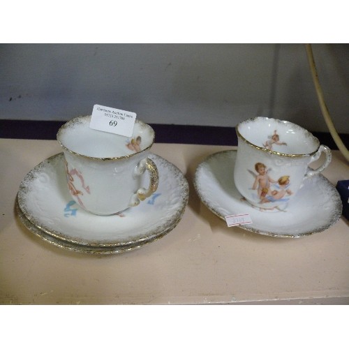 69 - VINTAGE CHINA PART TEASET DECORATED WITH CHERUBS.