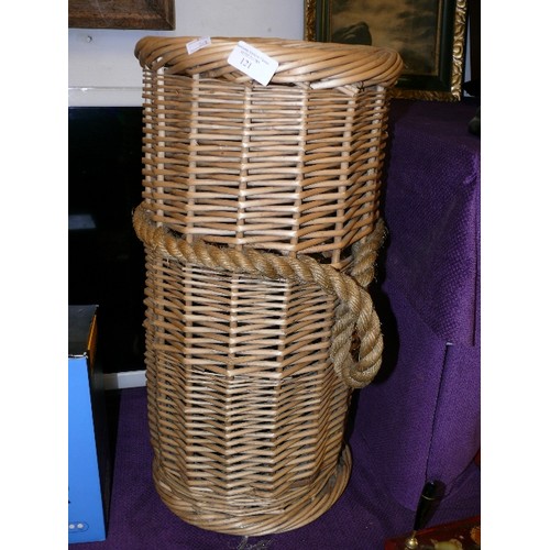 121 - WICKER UMBRELLA/ STICK STAND WITH ROPE HANDLES.