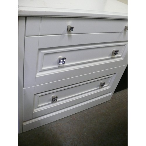 404 - WHITE CHEST OF THREE GRADUATED DRAWERS WITH GLASS KNOBS.