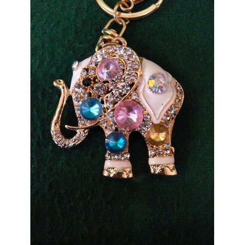 57 - FOUR KEYRINGS ENCRUSTED WITH BLING -  DOG, UNICORN, SEAHORSE AND AN ELEPHANT.