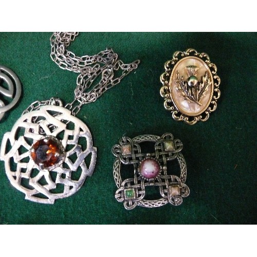 24 - SIX CELTIC BROOCHES AND A NECKLACE WITH A LARGE CELTIC PENDANTS.