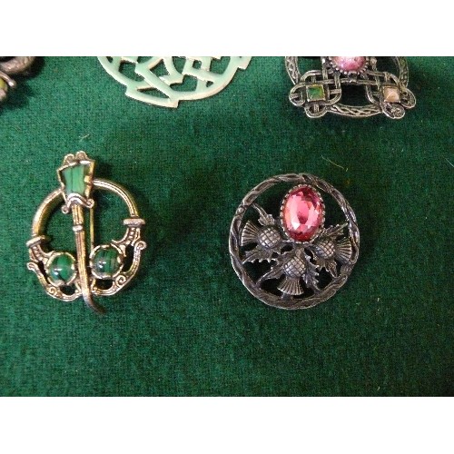 24 - SIX CELTIC BROOCHES AND A NECKLACE WITH A LARGE CELTIC PENDANTS.