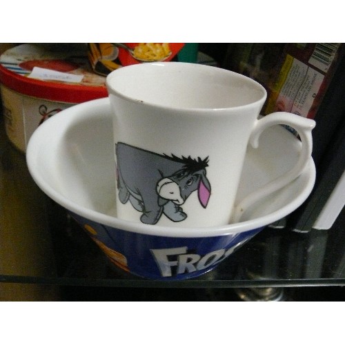 355B - KELLOGGS FROSTIES TIN AND A MUG GR RRRR EAT AND CEREAL BOWL AND AN EEYORE MUG.