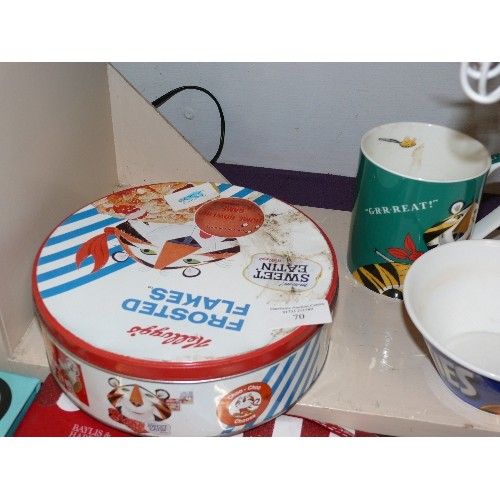 70 - KELLOGGS FROSTIES TIN AND A MUG GR RRRR EAT AND CEREAL BOWL AND AN EEYORE MUG.