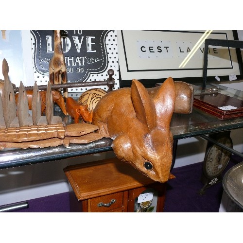 130 - A SELECTION OF DECORATIVE WOODEN TREEN ITEMS PLUS A VINTAGE CAST IRON STAND.