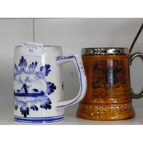 95 - AN ETCHED GLASS TANKARD WITH A PEWTER LID, TWO LORD NELSON POTTERY TANKARDS AND A DELFT BLUE TANKARD... 