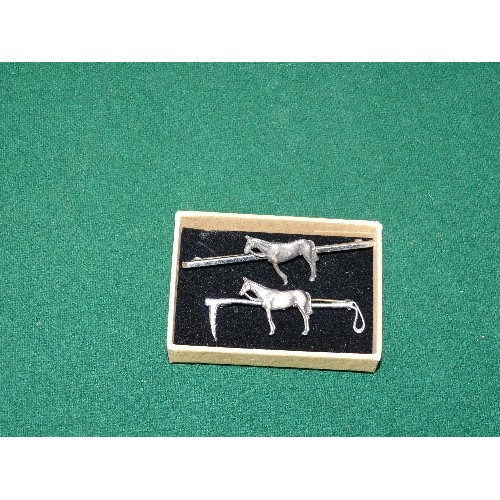 15 - TWO SILVER COLOURED HORSE BAR BROOCHES.