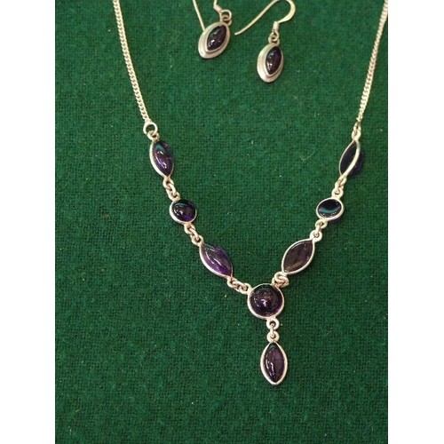 21 - A VERY PRETTY 925 SILVER NECKLACE AND EARRING SET WITH PURPLE STONES.