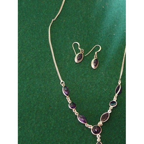 21 - A VERY PRETTY 925 SILVER NECKLACE AND EARRING SET WITH PURPLE STONES.