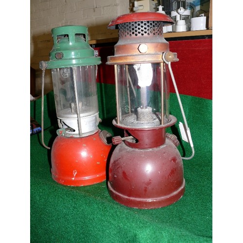 221 - TWO TILLEY LAMPS ONE RED TOP AND ONE GREEN TOP WITH LONGER GLOBES.