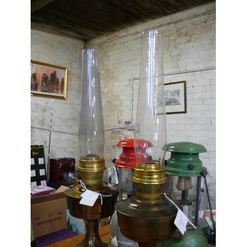 224 - TWO LAMPS AND GLASS CHIMNEYS