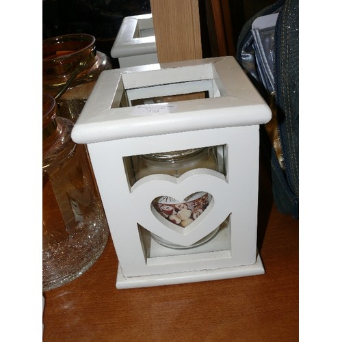 275 - HEAVY WOODEN SQUARE CANDLE HOLDER WITH HEART DECORATION AND A LARGE WHITE CHOCOLATE CANDLE.