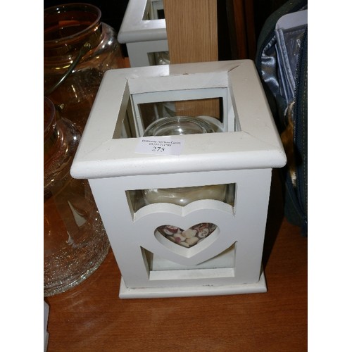 275 - HEAVY WOODEN SQUARE CANDLE HOLDER WITH HEART DECORATION AND A LARGE WHITE CHOCOLATE CANDLE.