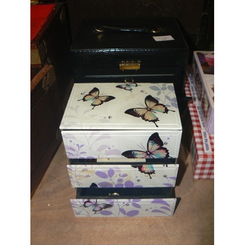 378 - TWO JEWELLERY CHESTS - ONE BLACK WITH DRAWERS AND HANDLE AND A BUTTERYFLY CHEST STORAGE BOX WITH CON... 