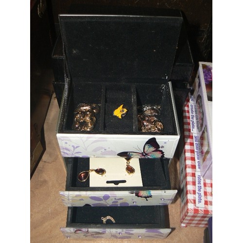 378 - TWO JEWELLERY CHESTS - ONE BLACK WITH DRAWERS AND HANDLE AND A BUTTERYFLY CHEST STORAGE BOX WITH CON... 