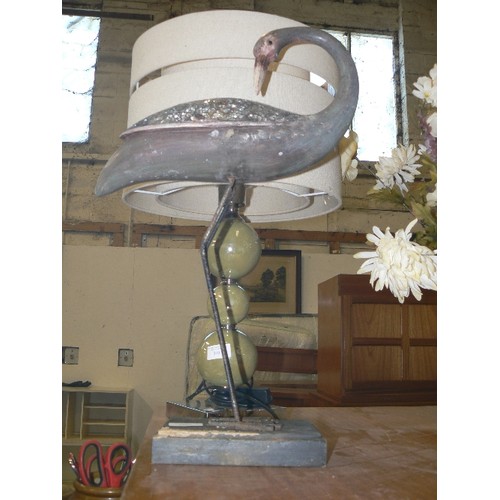 389 - METAL HERON ON A WOODEN PLINTH WITH MOSAIC GLASS WINGS.