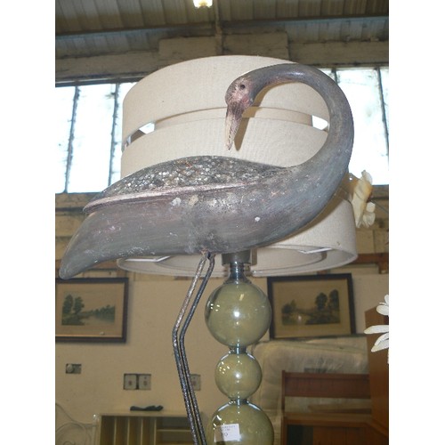 389 - METAL HERON ON A WOODEN PLINTH WITH MOSAIC GLASS WINGS.