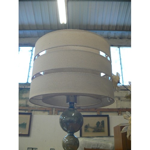 390 - TABLE LAMP WITH SAGE GREEN GLOBE STEM AND CREAM SHADE.