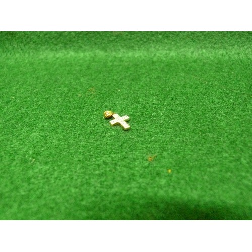 38 - A SMALL 9CT GOLD CROSS (TESTED AS DIAMOND).