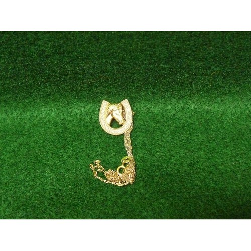 43 - A 9CT GOLD AND DIAMOND CHIP HORSE & HORSESHOE PENDANT ON A SILVER GILT CHAIN. PENDANT 2 GRAMS.