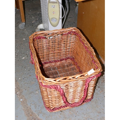 305 - LARGE WICKER BASKET WITH RED ROPE HANDLE DETAIL.