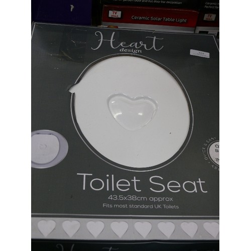 439 - TWO BOXED TOILET SEATS WITH LOVEHEART.