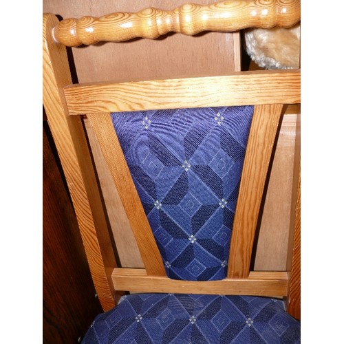 510 - TWO SOLID PINE DINING CHAIRS WITH BLUE UPHOLSTERY.