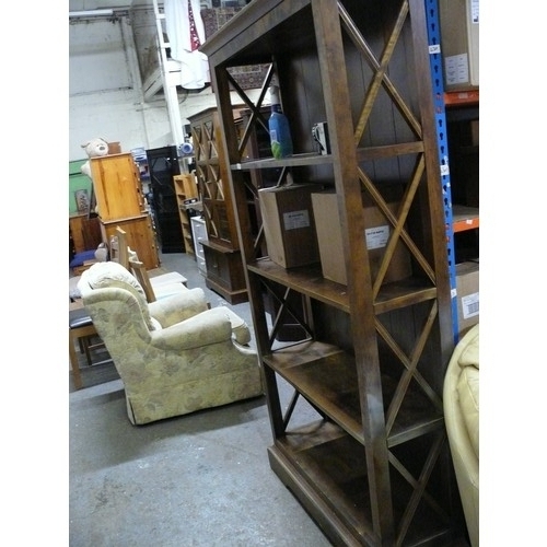 482 - SOLID BOOKCASE WITH WITH CROSSED WOODEN DECORATIVE SIDES.