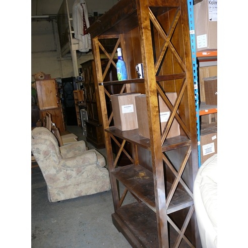 482 - SOLID BOOKCASE WITH WITH CROSSED WOODEN DECORATIVE SIDES.