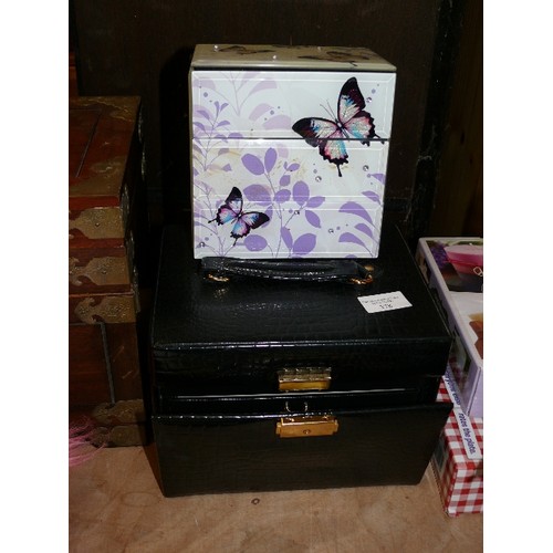 378 - TWO JEWELLERY CHESTS - ONE BLACK WITH DRAWERS AND HANDLE AND A BUTTERYFLY CHEST STORAGE BOX WITH CON... 