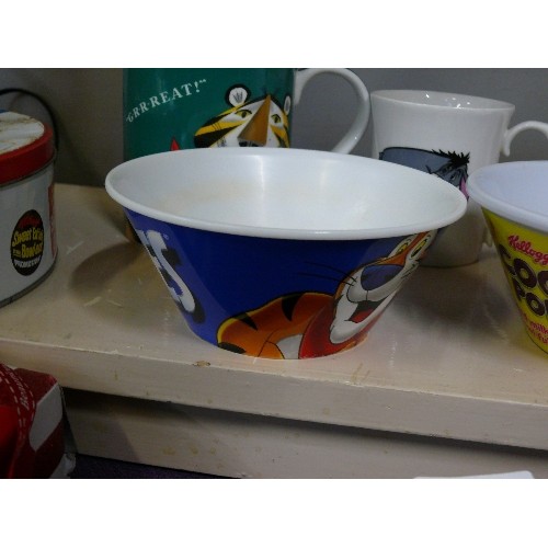 70 - KELLOGGS FROSTIES TIN AND A MUG GR RRRR EAT AND CEREAL BOWL AND AN EEYORE MUG.