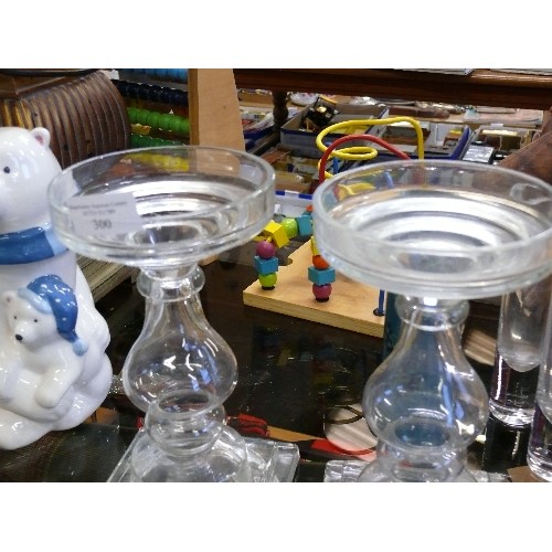 300 - A PAIR OF LARGE GLASS CANDLEHOLDERS, TWO GLASS VASES AND A CERAMIC VASE.